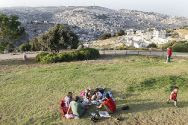 Young Israelis enjoy a picnic at the Armon HaNatziv Promenade overlooking the city of Jerusalem. (archive)