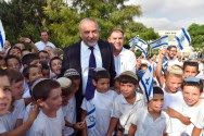 Defense Minister Avigdor Liberman visits students at a school in Susya, on their first day of school, September 1, 2016.