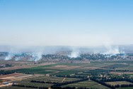 Smoke rises near Quneitra Crossing as it seen from the Golan Heights, August 27, 2014.
