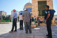 Jews are watched by guards on the Temple Mount, to make sure they don't pray.