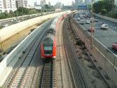 The Israel Railways tracks running through downtown Tel Aviv, with Rt. 20 on either side.